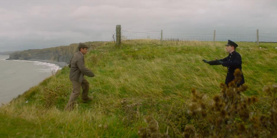 Brendan tries to convince the criminal to surrender after he has cornered him at the edge of the cliff.