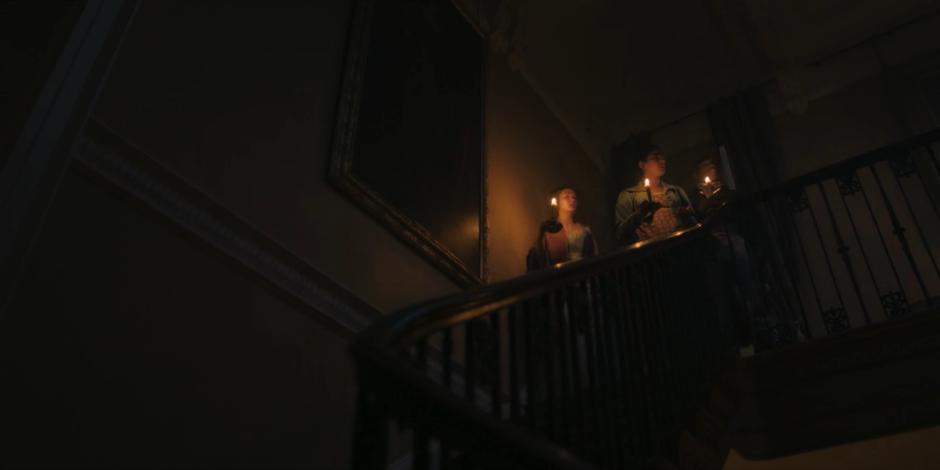 Mary, Yaz, and Ryan stop after finding themselves back at the top of the stairs after walking down.