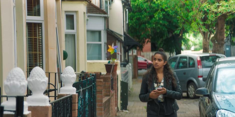 Yaz walks down the street looking for Anita's home.