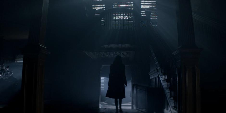 Alice walks out of the main hall towards the basement after hearing a sound.