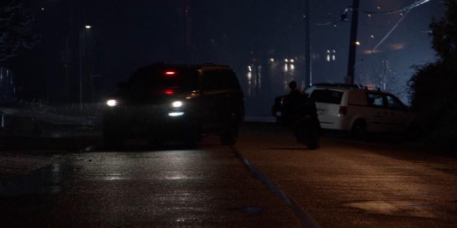 Kate dodges around a Crows Security vehicle as she races away with Sophie.