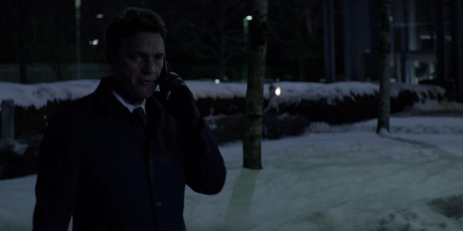 Jacob talks to Sophie on the phone while walking to his car.