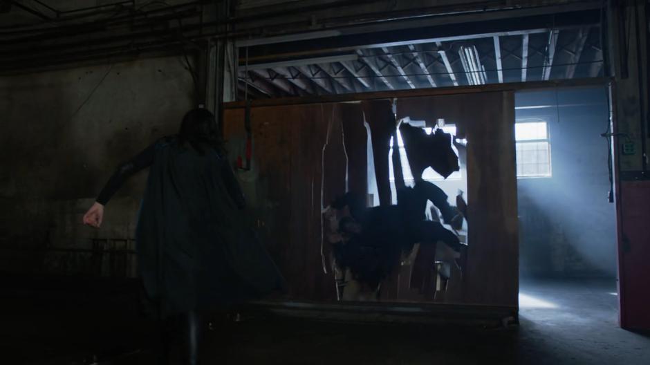 Alex throws Hank Henshaw through a wood wall after escaping her bonds.