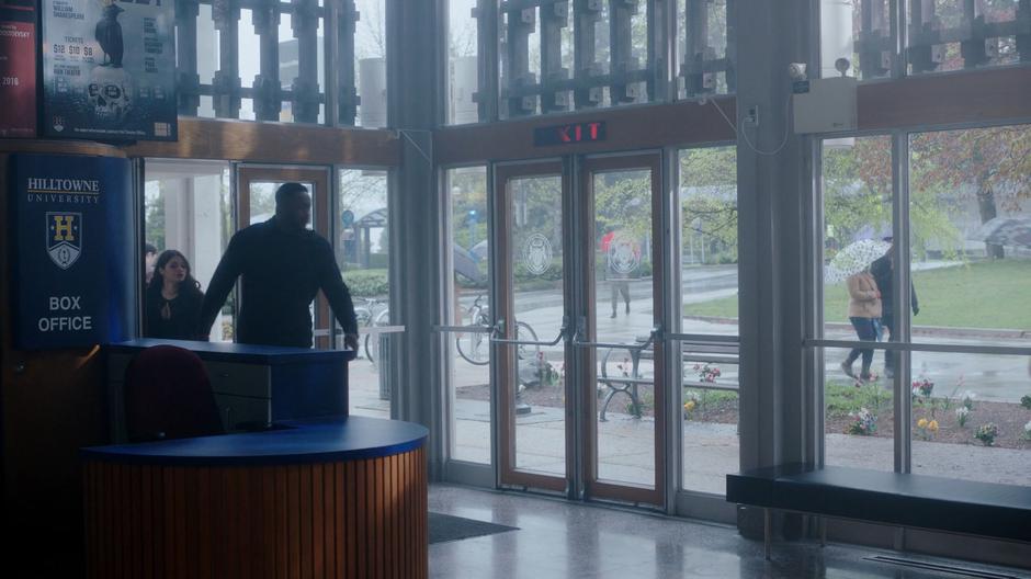 Mel follows Galvin into the lobby of the theater.