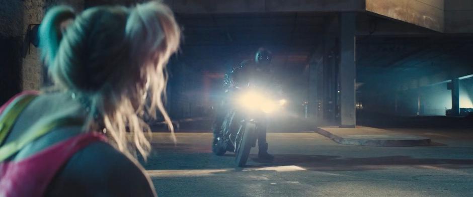 Helena pulls up on her motorcycle to help Harley after she is knocked to the ground.