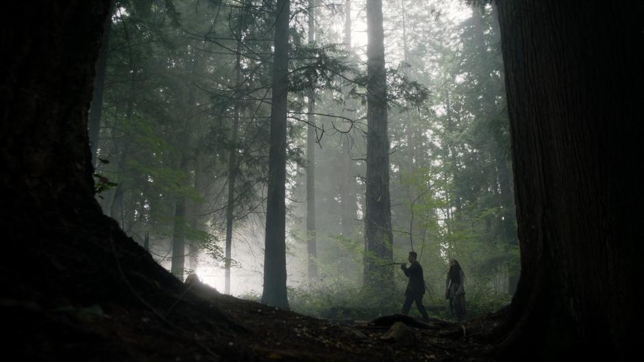 Josh dowses through the forest with Eliot as Margo following him.