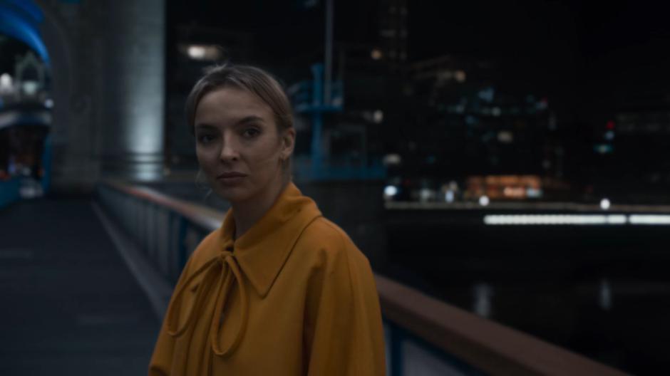 Villanelle stops and turns to look back at Eve.