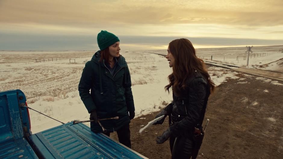 Wynonna tries to convince Nicole to come with her to Monument while they stand at the back of the truck.