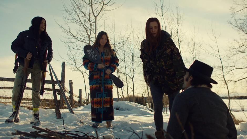 Rachel and Waverly smile at Doc as Nicole steps down to free him from the trap.