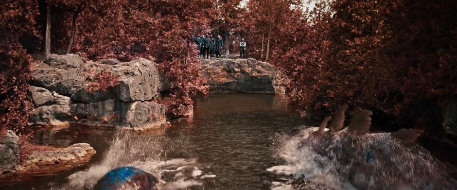 Several trance worm frolic in the waters as Booker, Michael, and the others watch.