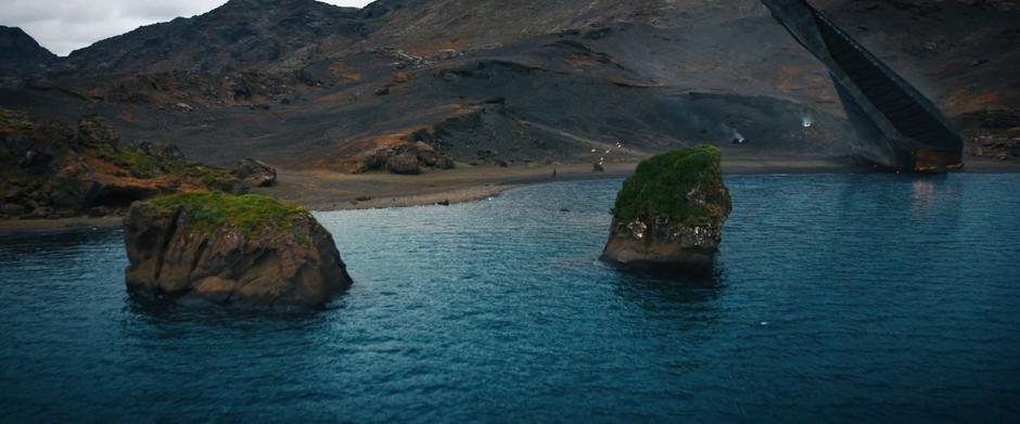 Michael walks down the beach towards the crashed ship.