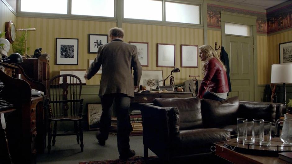 Emma talks to Archie in his office.
