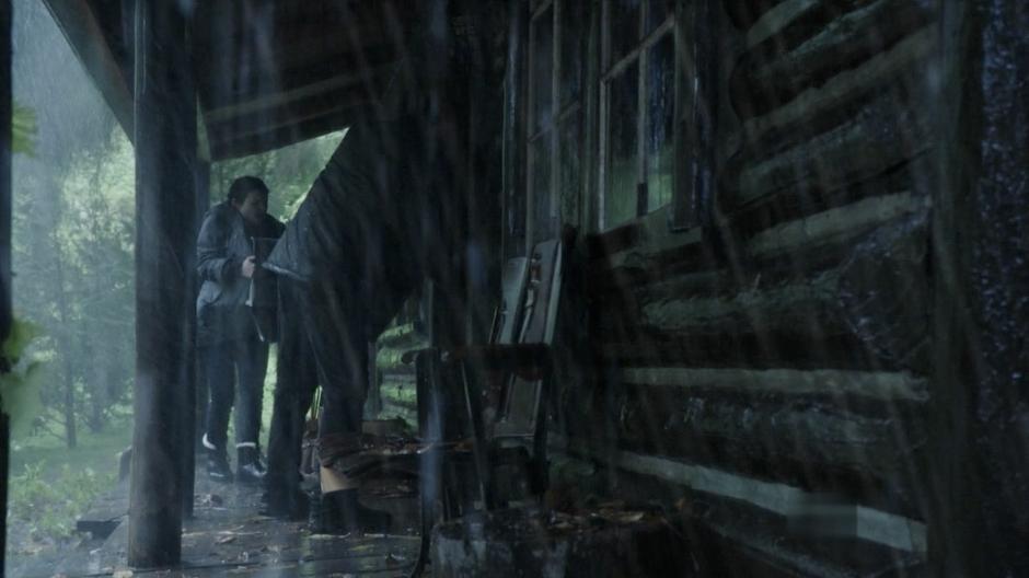 David and Mary Margaret enter a cabin during a storm.