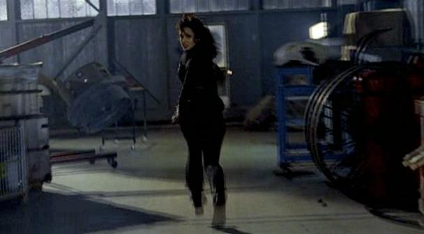 Max runs through the hanger trying to escape the guards.