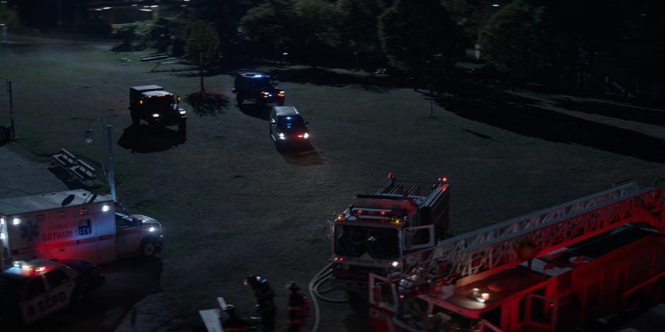 Three Crows vehicles drive across the park to where the rescue teams are working.