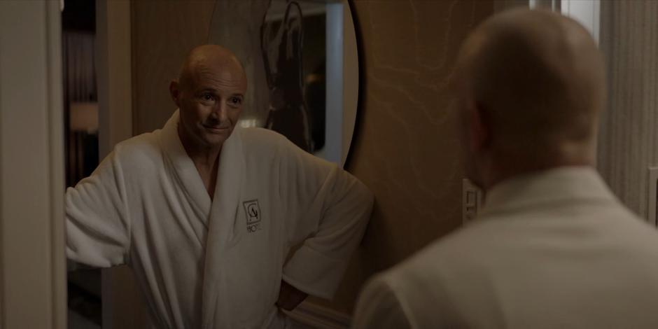 Vin Capalaci talks to Victor Zsasz who is posing as room service.