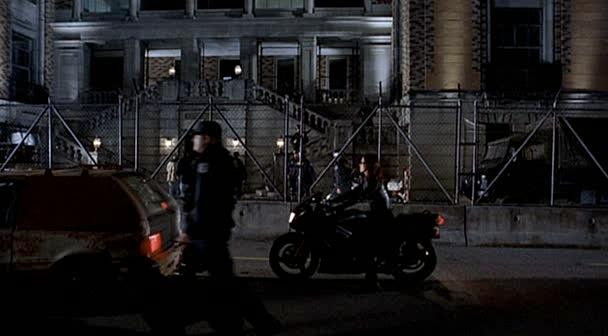 Max drives past the front of the police department.