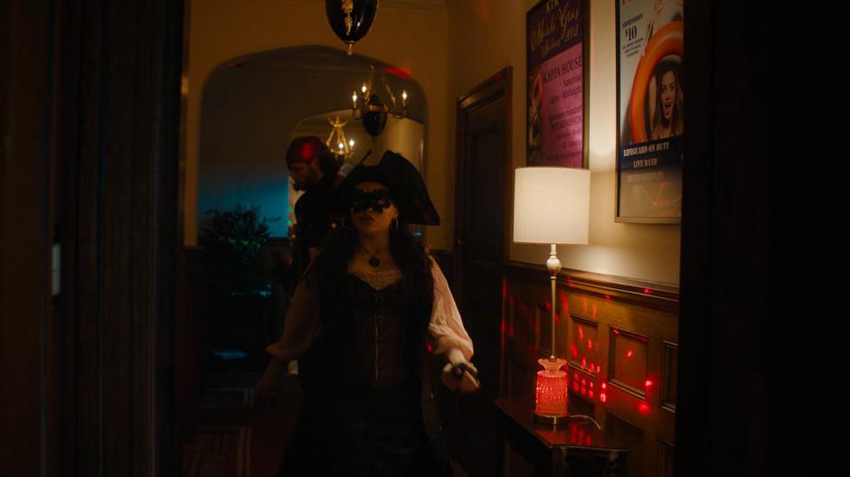 Maggie leads Jordan to the room where she believes she hid the piece of the Source while disguised as a pirate.