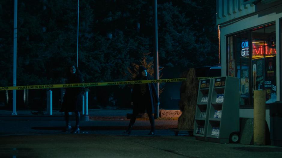 Macy and Maggie search the gas station for clues.