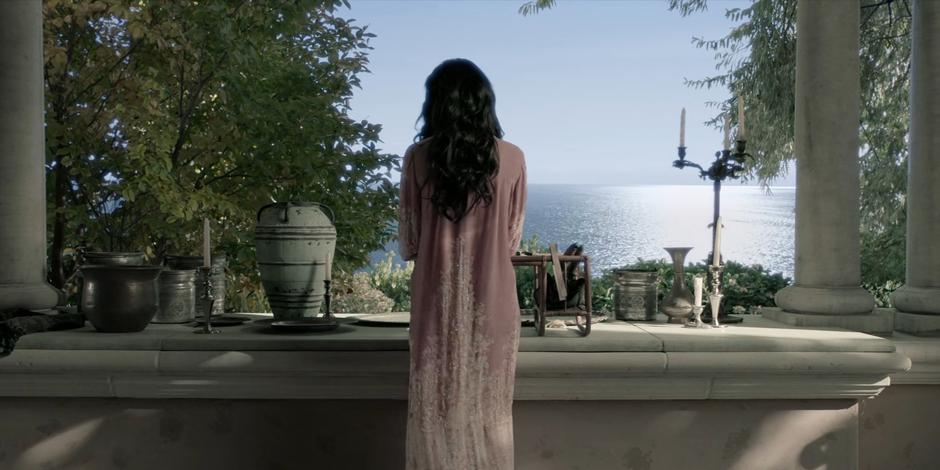 Safiyah looks over the ocean as she waits for Alice to be brought to her.