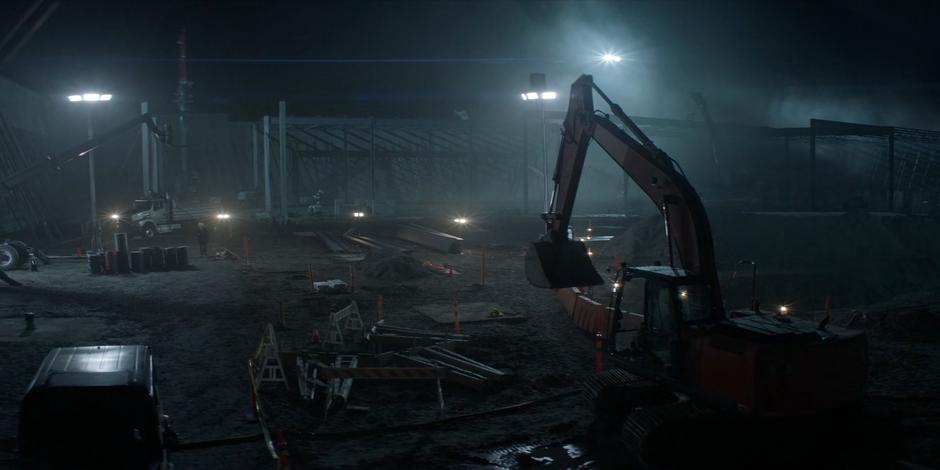 Ellis O'Brien walks through his construction site at night.