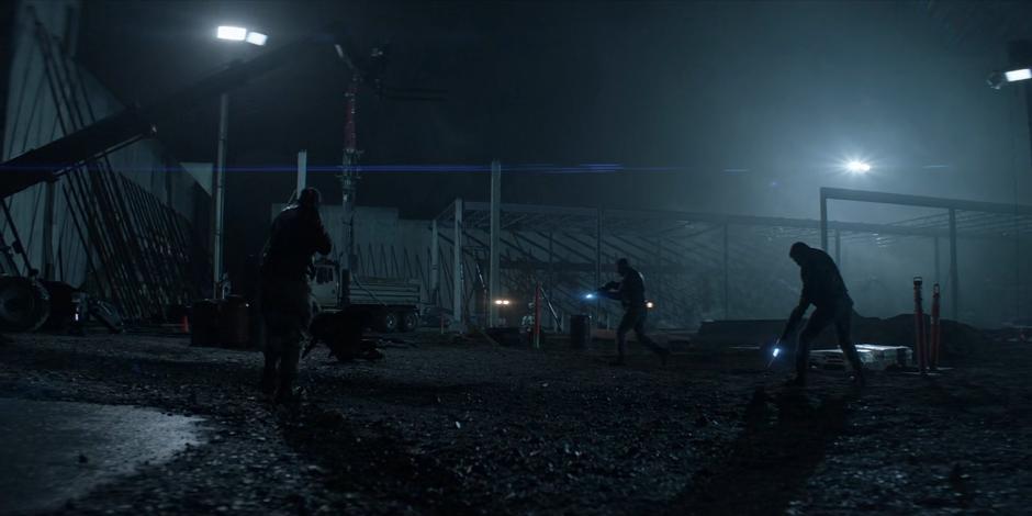 Three guards with lightning guns surround Ryan.