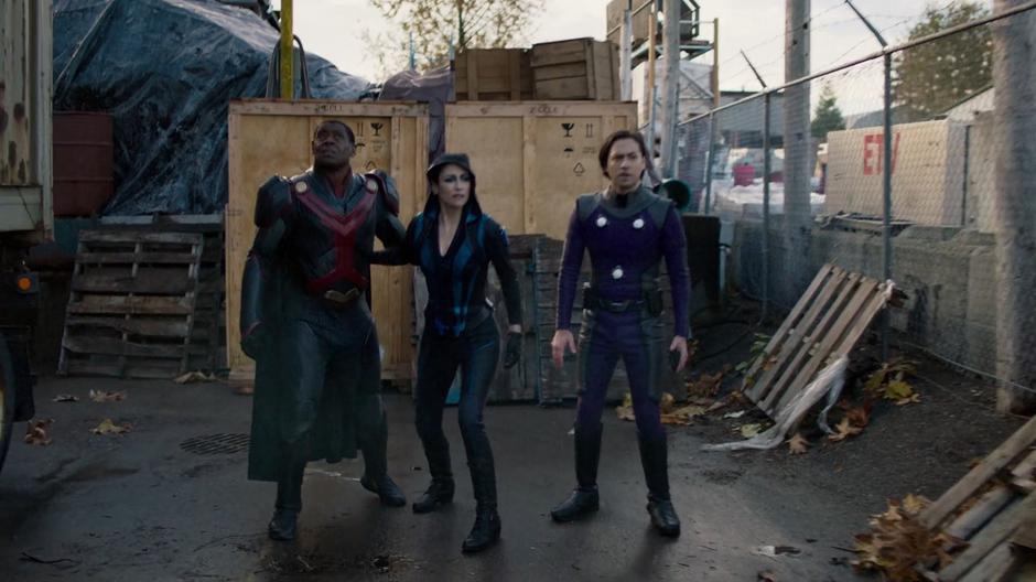 J'onn, Alex, and Brainy land and begin searching for M'gann and the Phantom.