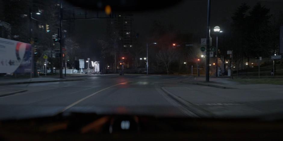 View through Ryan's windshield as she races down the street.