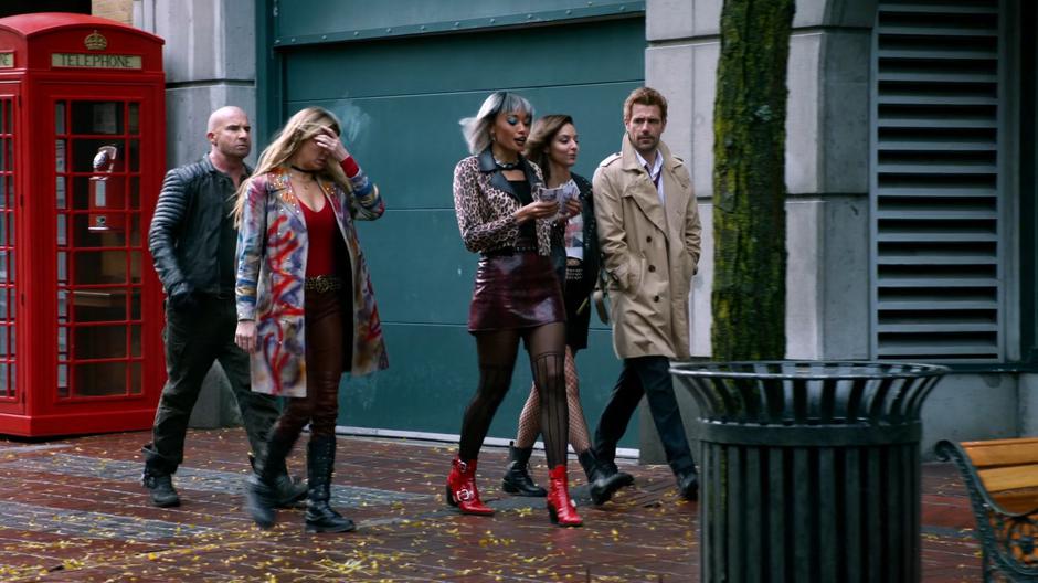 Mick, Ava, Astra, Zari, and Constantine walks down the street with Astra counting her winnigs.