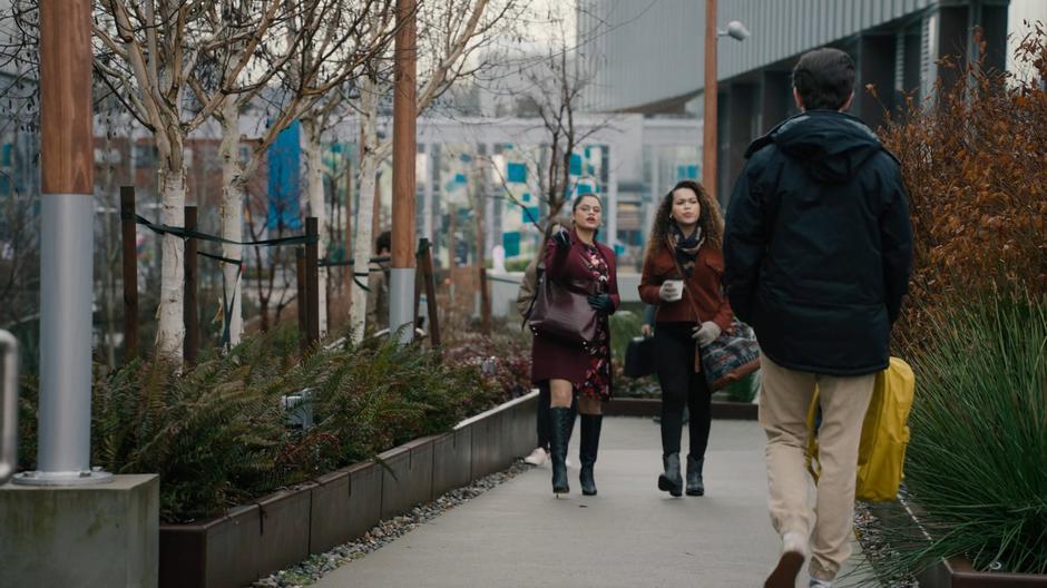 Mel walks with Josefina outside and points out the features of the college.