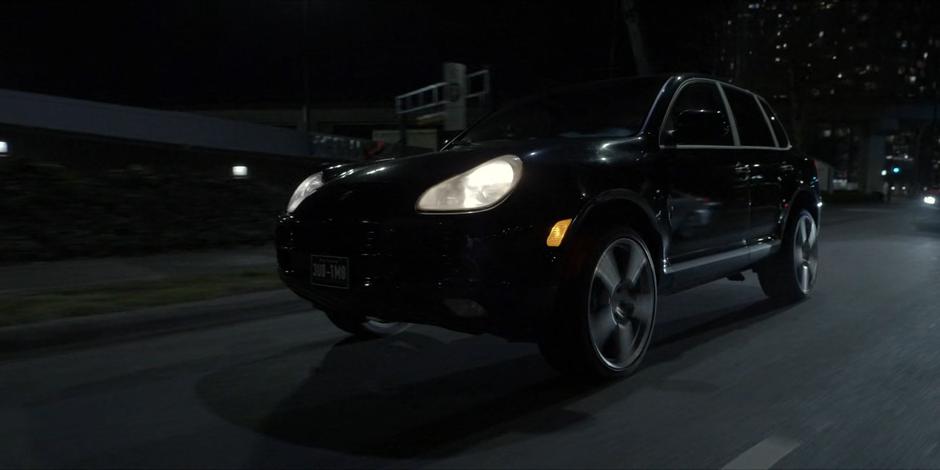 Eli weaves through traffic in his stolen car.