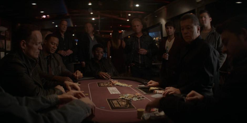 Luke and everyone at the table wait as Tavaroff tries to meet his bet.