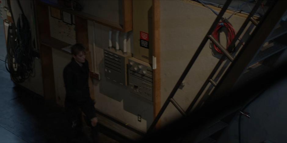 Kate walks to the stairs leading to the control room.