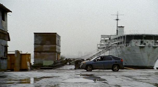 Logan drives up to the port.