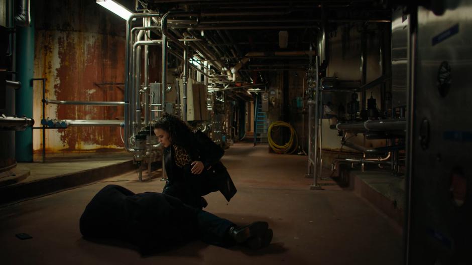 Maggie kneels over Harry after fighting off the Whispering Evil.