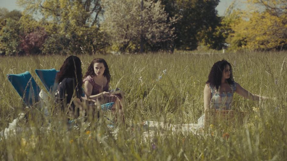 Mel and Maggie talk while Macy sets out a picnic.