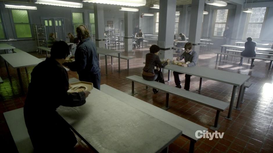 Astrid and Sean Keenan have lunch in the cafeteria.