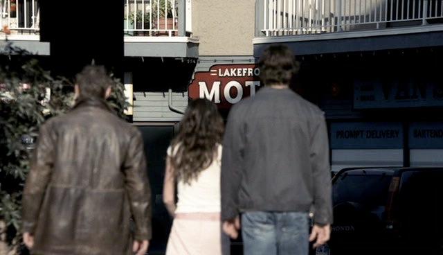 Andrea Barr leads Sam & Dean to their motel.