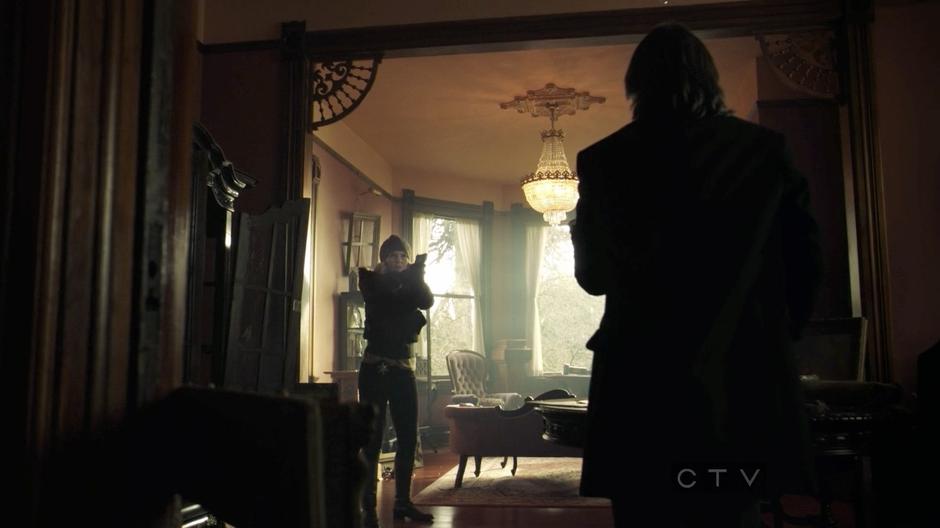 Emma comes upon Mr. Gold holding a gun in his house after it was robbed.