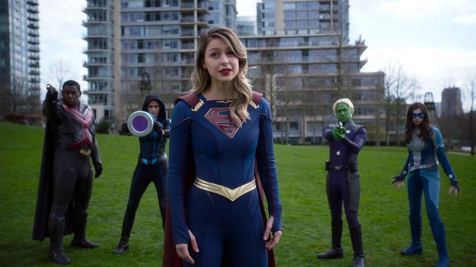 Kara steps forward in front of J'onn, Alex, Brainy, and Nia to try to reason with Nxyly one last time.