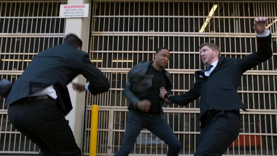 Diggle fights off Councilwoman Rankin's two guards.