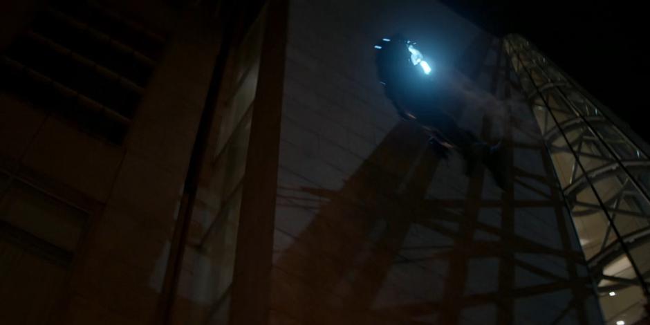 Luke uses his new suit to fly to the roof of the theater.