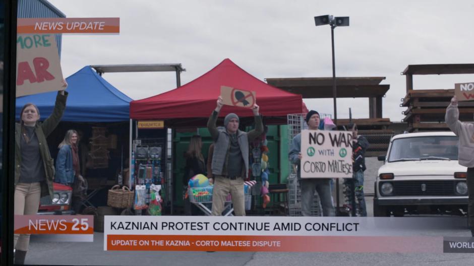 A news report shows Kaznian anti-war protestors.