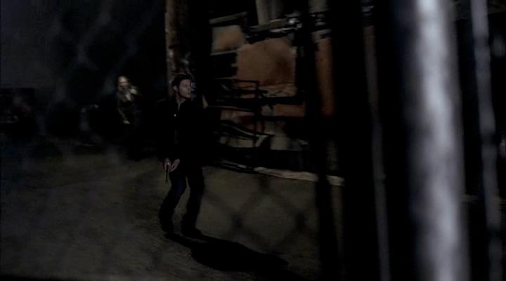 Dean searches down the alley for the shapeshifter.