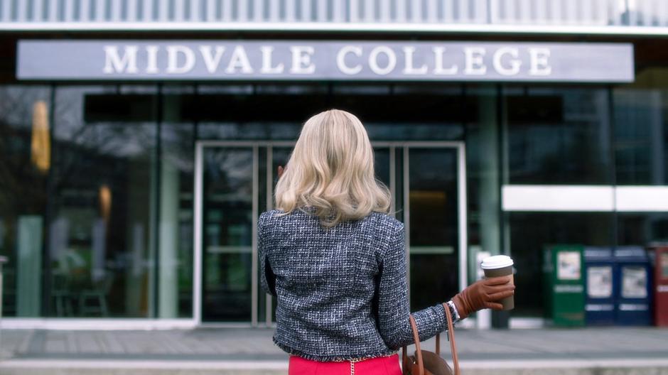 CJ Grant completes her phonecall as she stands outside the Midvale College building.