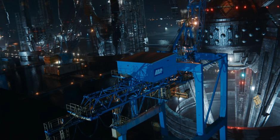 Dan reaches the top of the crane where it is connected to the Sontaran ship.