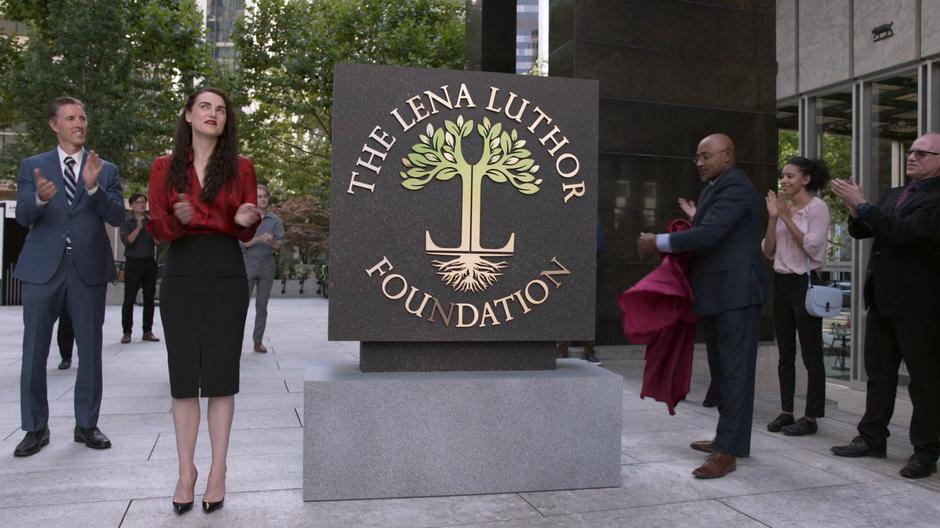 Lena looks to the sky as the sign for her new foundation is unveiled.