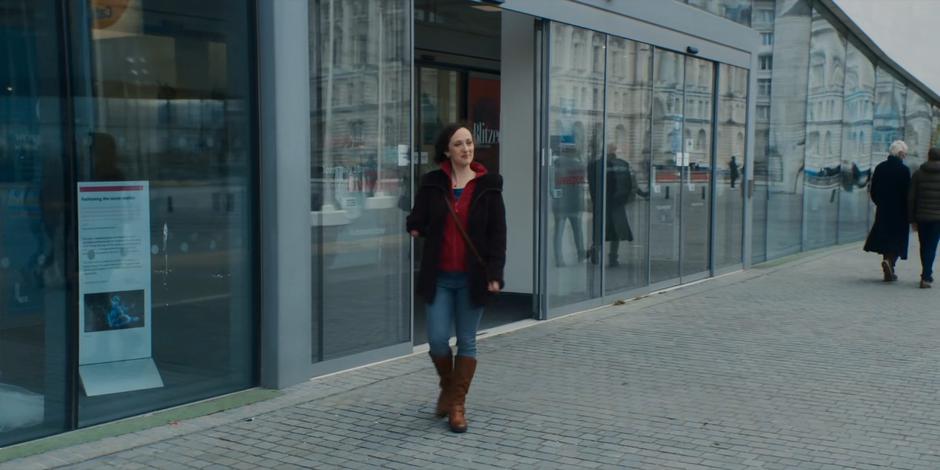 Diane smiles when she sees Dan waiting outside for her with coffee.