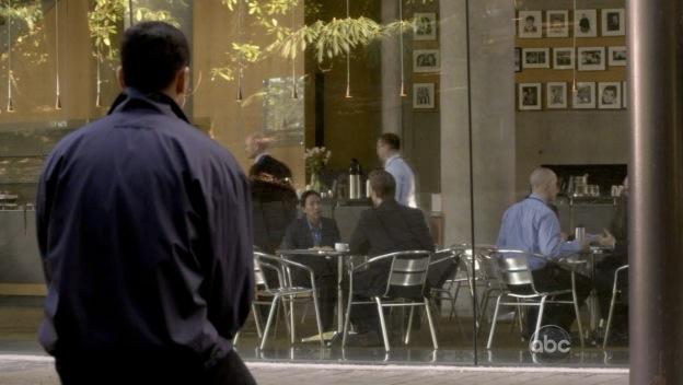 Ajay stares into the ISO cafeteria from the outside.