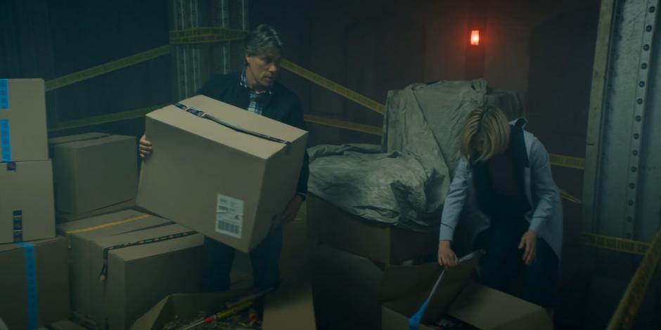 Dan talks to the Doctor about Yaz's feelings while they go through the boxes of fireworks.